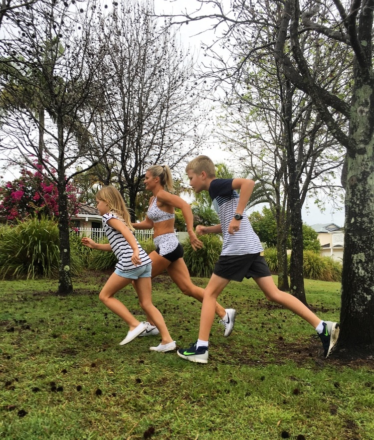 Belinda Norton Smith running with two children